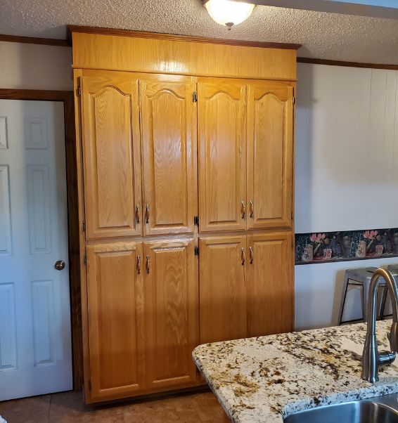 wooden tall cabinet in kitchen mcdonald tn