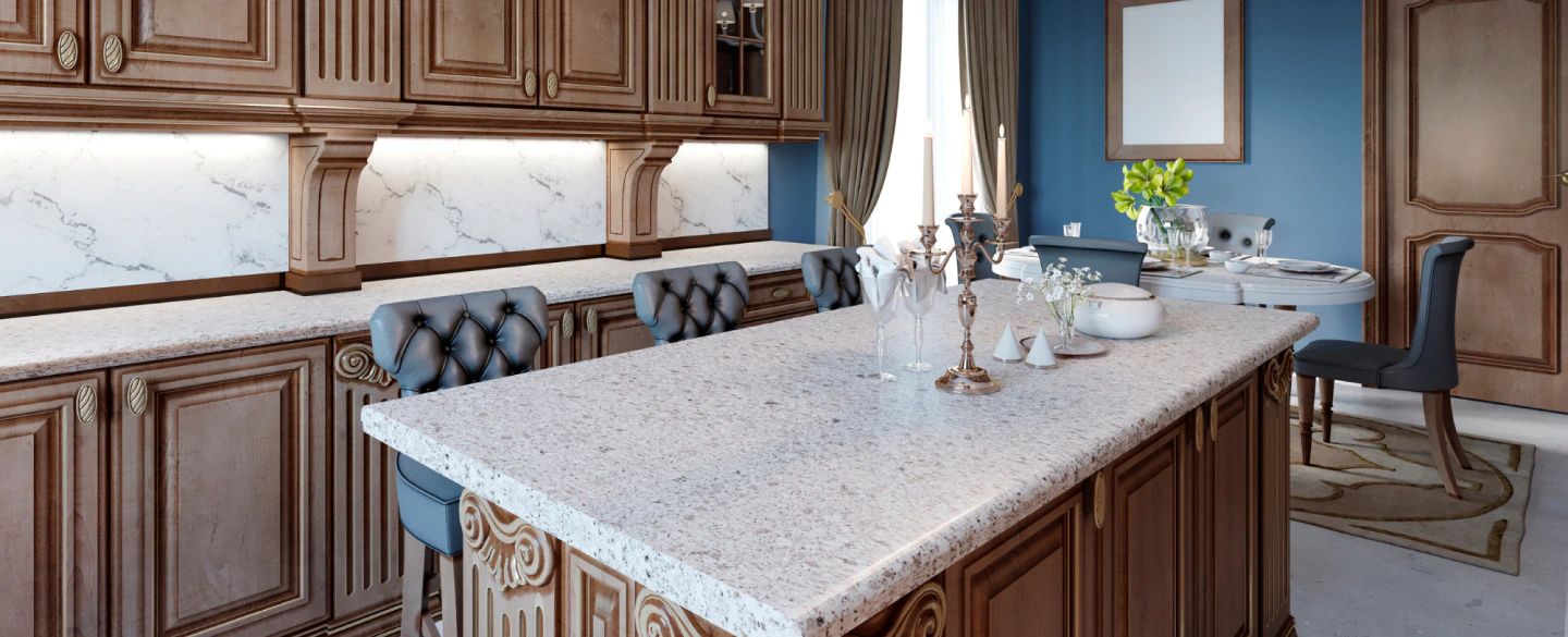 blue kitchen with brown cabinetry and a marbled countertop